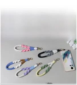 Detail of five handmade braided lanyards with spiral weave and gold lobster clasps