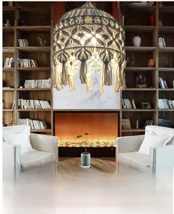Bohemian hand-woven cotton lampshade with long tassels in a cozy living room setting