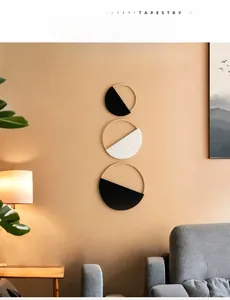 Three-piece bohemian woven wall decor with round wooden hoops in a cozy interior setting
