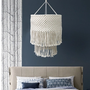 Detail of bohemian macrame lampshade with double layered fringe and woven patterns