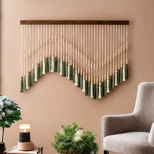 Bohemian woven tapestry with tassels and wooden beads on a dark solid wood beam