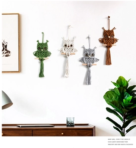 Detailed set of four handmade macrame owl wall hangings in diverse natural colors