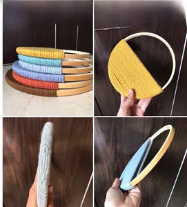 Detail of bohemian woven wall decor with round bamboo rings in various vibrant colors