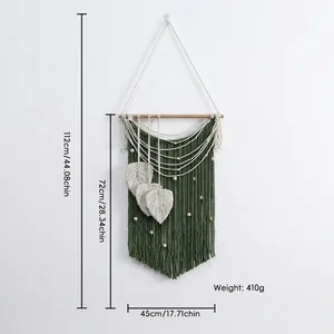 Handmade green boho wall tapestry with white leaves, wood beads and size measurements