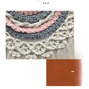 Detailed close-up of handmade macramé wall hanging with cotton cords and soft tassels