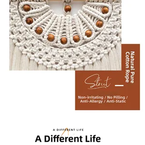 Detailed close-up of woven cotton rope texture and brown wooden beads on bohemian tapestry