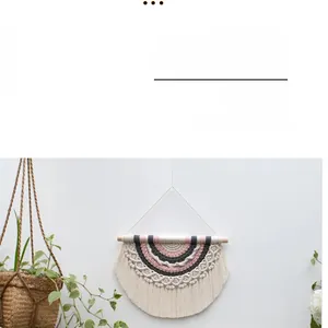 Detail of handmade Nordic macrame wall hanging with pink and grey cotton rope tassels