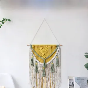 Close-up of geometric diamond texture on bohemian handmade cotton fringe tapestry