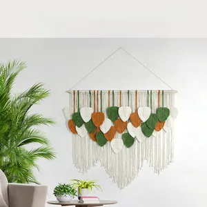 Detailed close-up of bohemian leaf-shaped handwoven cotton macrame wall hanging tapestry
