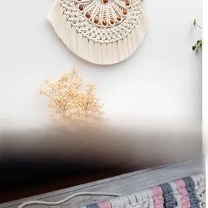 Close-up detail of Bohemian cotton rope tapestry featuring wooden beads and tassels