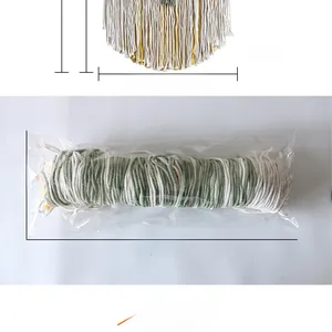 Detail view of handmade cotton macrame wall hanging showing fringe texture and 50cm width
