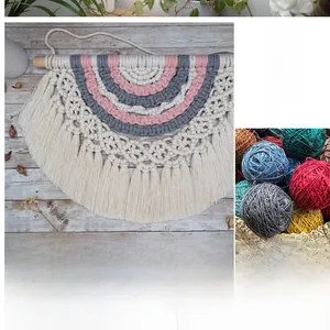 Detail of pink and grey cotton rope tapestry with handmade fringe and wood rod