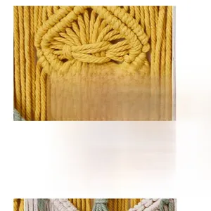 Detailed close-up of handmade yellow macrame wall hanging with diamond weave textures