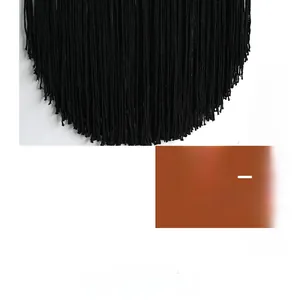 Detailed close-up showing the dense black cotton fringe texture of this bohemian tapestry wall hanging