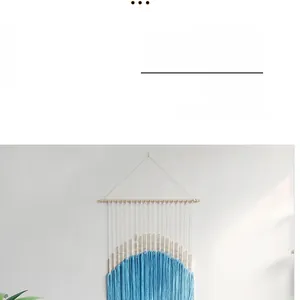 Detail of blue Bohemian woven wall hanging with wooden beads and Nordic tassel accents