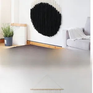Detail of bohemian hand-woven wall tapestry with black circular pattern and wooden beads