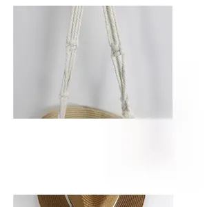 Close-up of Bohemian hand-woven cotton rope knot detail on a brown wall hanging rack