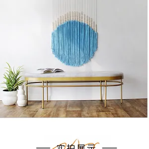 Detail view of Bohemian round blue macrame wall hanging with wooden beads decoration