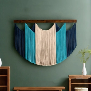 Handmade bohemian woven tapestry wall hanging with blue cotton tassels and wooden rod