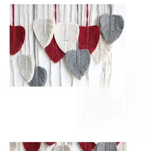 Close-up of handmade Bohemian leaf-shaped woven wall hanging in red, cream, and grey