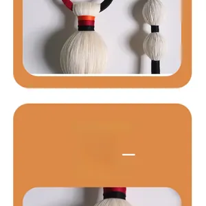 Detail of Nordic woven fiber art pendant with white cotton yarn and colorful accents