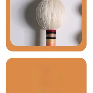 Macro shot of colorful hand-woven decorative handle with spherical ball and tassel detail