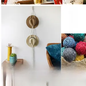 Detail of macrame cotton rope hat rack displaying bohemian style wall hanging storage