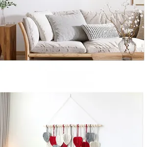 Detail of bohemian hand-woven macrame wall hanging with colorful leaf tassels in cotton