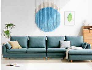 Modern grey-blue fabric L-shaped sectional sofa with bohemian woven wall hanging decor