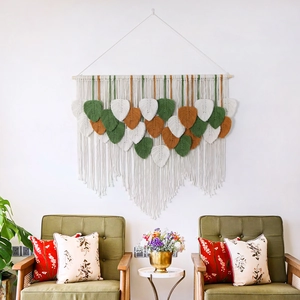 Handwoven macrame wall hanging with autumn leaves decor for bohemian home interior styling