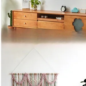 Detail view of colorful macrame leaf wall hanging decor for home and hotel bedroom