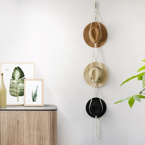 Bohemian handwoven cotton rope hat rack featuring a three-tier vertical wall hanging design