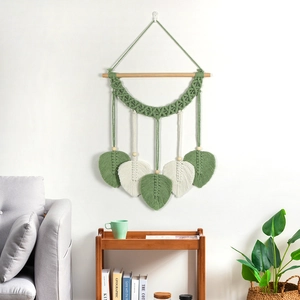 Décoration murale bohème avec feuilles tissées en coton et perles en bois
