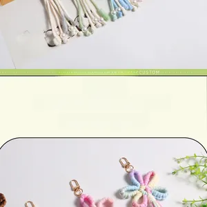 Detailed handmade bohemian woven flower keychain with pink cotton petals and gold spring hook