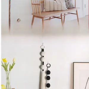 Detail view of handmade Bohemian cotton ball tassels for Nordic style door and wall decor