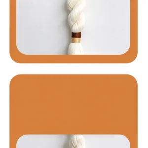 Close-up of ivory white tassel with gold accents for Nordic style wall hanging decor
