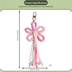 Detail showing dimensions of handmade boho daisy crochet keychain with pink tassels