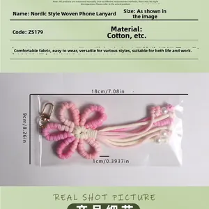 Macro view of woven pink flower keychain with white pearl beads and dimensions
