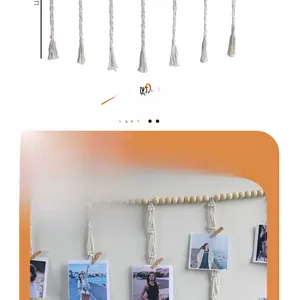 Detail of hand-woven cotton bohemian photo wall hanging with wood clips and tassels