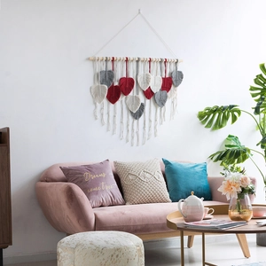 Bohemian handmade macrame leaf wall hanging with red, grey, and white cotton leaf tassels