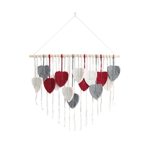 Bohemian hand-woven leaf macrame wall hanging with red and grey tassels on wood