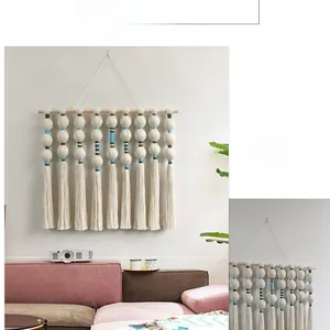 Detailed macro view of bohemian hand-woven cotton ropes and colored tassel ornaments
