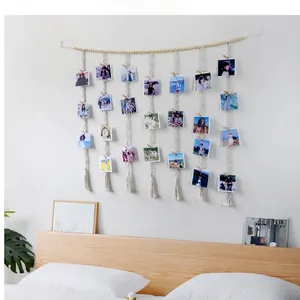 Detail showing the cotton ropes, wooden beads and clips for photo display wall hanging
