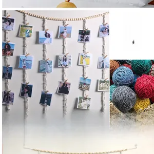 Detailed view of handmade macrame photo display with cotton rope and wooden clips