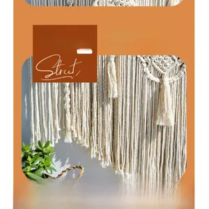 Detailed close-up of bohemian woven cotton tapestry with fringe and geometric textures