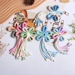 Handmade woven flower keychain with colorful tassels and gold lobster clasp for bags