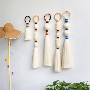 Five-piece Nordic style hand-woven wall hangings with cotton tassels and wooden rings