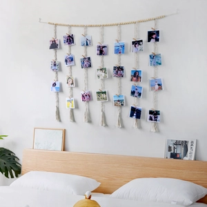 Handmade woven macrame wall hanging photo display with wooden beads and clips