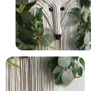 Close-up of handmade macrame fox wall hanging with cotton weaving and green eucalyptus leaves