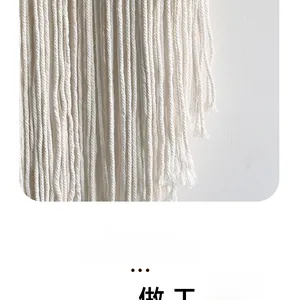 Detail of handcrafted Nordic cotton tassels and intricate bohemian macrame knots texture